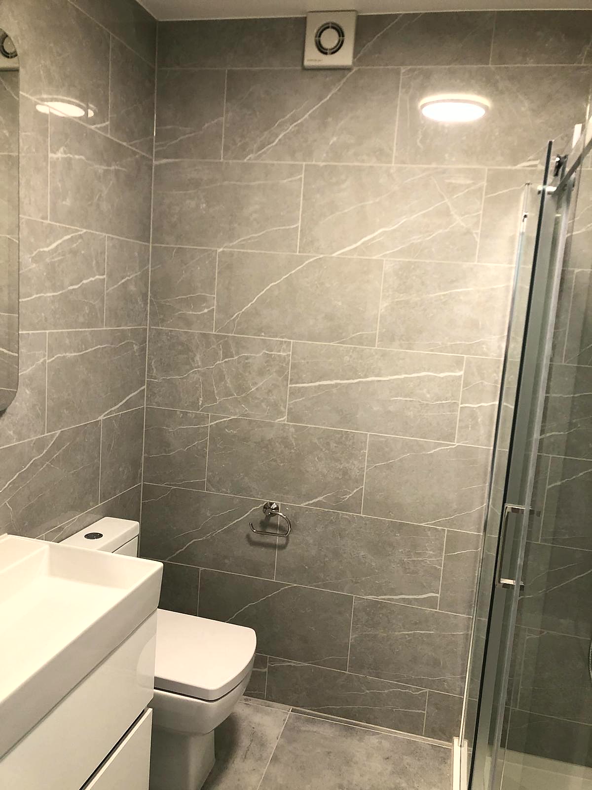 Wet room installation with tanked shower area, London